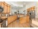 Modern kitchen with light wood cabinets, granite countertops, and stainless steel appliances at 5210 Sailwind Cir, Orlando, FL 32810