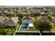 High-angle view of a house with a pool in a residential area at 526 First Cape Coral Dr, Winter Garden, FL 34787
