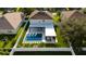 Backyard oasis with a luxurious pool and modern pergola at 526 First Cape Coral Dr, Winter Garden, FL 34787