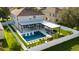 Two-story house with a large backyard, pool, and modern pergola at 526 First Cape Coral Dr, Winter Garden, FL 34787
