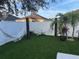 Landscaped backyard with artificial turf and two hammocks at 526 First Cape Coral Dr, Winter Garden, FL 34787