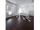 Spacious bedroom with dark floors and window seat at 526 First Cape Coral Dr, Winter Garden, FL 34787
