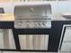 Stainless steel built-in outdoor grill with side burner at 526 First Cape Coral Dr, Winter Garden, FL 34787