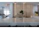 Modern kitchen with wood cabinets and marble island at 526 First Cape Coral Dr, Winter Garden, FL 34787