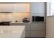 Modern kitchen with built-in microwave and oven at 526 First Cape Coral Dr, Winter Garden, FL 34787