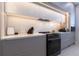 Modern kitchen with sleek cabinetry, quartz countertops, and high-end appliances at 526 First Cape Coral Dr, Winter Garden, FL 34787