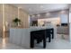 Modern kitchen with marble island and sleek cabinetry at 526 First Cape Coral Dr, Winter Garden, FL 34787