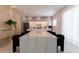 Spacious kitchen featuring a large marble island and stainless steel appliances at 526 First Cape Coral Dr, Winter Garden, FL 34787