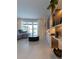 Bright living room showcasing a sleek media wall and pool view at 526 First Cape Coral Dr, Winter Garden, FL 34787