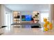 Open living area with modern furniture and large TV at 526 First Cape Coral Dr, Winter Garden, FL 34787