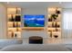 Living room with built-in media wall and shelving at 526 First Cape Coral Dr, Winter Garden, FL 34787
