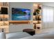 Large TV and built-in shelving in living room at 526 First Cape Coral Dr, Winter Garden, FL 34787