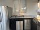 Outdoor kitchen with sink, refrigerator, and stainless steel drawers at 526 First Cape Coral Dr, Winter Garden, FL 34787