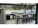 Modern outdoor kitchen with granite counters and stainless steel appliances at 526 First Cape Coral Dr, Winter Garden, FL 34787
