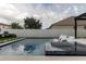 Luxury pool with built-in spa and comfortable lounge chairs at 526 First Cape Coral Dr, Winter Garden, FL 34787