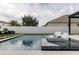 Modern pool and spa with built-in seating and patio at 526 First Cape Coral Dr, Winter Garden, FL 34787