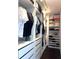 Large walk-in closet with custom shelving and drawers at 526 First Cape Coral Dr, Winter Garden, FL 34787