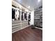Spacious walk-in closet with ample shelving and hanging space at 526 First Cape Coral Dr, Winter Garden, FL 34787