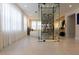 Modern glass-encased wine cellar is a focal point of this luxurious home at 526 First Cape Coral Dr, Winter Garden, FL 34787