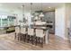Modern kitchen with gray cabinets, a large island, and stainless steel appliances at 5278 Bowspirit Way, St Cloud, FL 34769