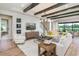 Spacious living room with exposed beams, a large sectional sofa, and hardwood floors at 5278 Bowspirit Way, St Cloud, FL 34769