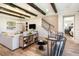 Open living area with exposed beams, a white shiplap wall and hardwood floors at 5278 Bowspirit Way, St Cloud, FL 34769