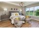 Spacious main bedroom with sitting area and large window at 5278 Bowspirit Way, St Cloud, FL 34769