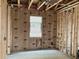 Under construction interior room with framing and insulation at 5748 Haystack Dr, St Cloud, FL 34771