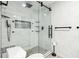 Sleek bathroom featuring a glass-enclosed shower with black hardware and modern fixtures at 6121 Bass Hwy, St Cloud, FL 34771