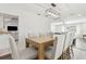Bright dining area with a wooden table, chairs, and view leading to an adjacent living space at 6121 Bass Hwy, St Cloud, FL 34771