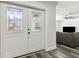 Home's double front doors leading to a living room with wood flooring at 6121 Bass Hwy, St Cloud, FL 34771