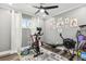 Bright exercise room equipped with stationary bike and rowing machine for a complete workout at 6121 Bass Hwy, St Cloud, FL 34771
