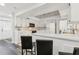 Bright kitchen features white cabinetry, modern appliances, and a breakfast bar with seating at 6121 Bass Hwy, St Cloud, FL 34771