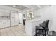 Bright kitchen with white cabinets, a breakfast bar, and modern seating at 6121 Bass Hwy, St Cloud, FL 34771