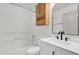 Clean bathroom features shower-tub, white vanity with black hardware, and vanity mirror at 629 Dory Ln # 108, Altamonte Springs, FL 32714