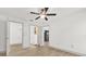 Bedroom showing an ensuite bathroom, ceiling fan, and neutral walls with light vinyl flooring at 629 Dory Ln # 108, Altamonte Springs, FL 32714