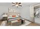Bright bedroom features a ceiling fan, neutral decor, large window, and a comfortable bed at 629 Dory Ln # 108, Altamonte Springs, FL 32714