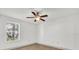 This bedroom features vinyl flooring, a ceiling fan, and a window providing natural light at 629 Dory Ln # 108, Altamonte Springs, FL 32714