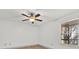 Bright bedroom with a ceiling fan, neutral decor, and a large window at 629 Dory Ln # 108, Altamonte Springs, FL 32714