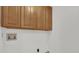 The laundry room features wooden cabinets with lots of storage space, and new fixtures at 629 Dory Ln # 108, Altamonte Springs, FL 32714