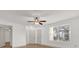 Bright living room featuring a ceiling fan, vinyl flooring, and a window with natural light at 629 Dory Ln # 108, Altamonte Springs, FL 32714