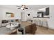 Living room showcasing wood flooring, neutral color palette, contemporary furnishings and breakfast bar at 629 Dory Ln # 108, Altamonte Springs, FL 32714