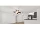 Bright living room featuring modern ceiling fan, hardwood floors, and gray kitchen cabinets at 629 Dory Ln # 108, Altamonte Springs, FL 32714
