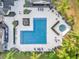 Aerial view of resort-style pool and spa with surrounding lounge chairs at 629 Dory Ln # 108, Altamonte Springs, FL 32714