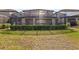 Screened patio and backyard with lush landscaping at 8833 Corcovado Dr, Kissimmee, FL 34747