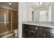 Bathroom boasts granite countertop vanity and shower at 8833 Corcovado Dr, Kissimmee, FL 34747