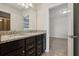 Double vanity bathroom with granite countertop at 8833 Corcovado Dr, Kissimmee, FL 34747