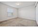 Bedroom with window and neutral carpeting at 8833 Corcovado Dr, Kissimmee, FL 34747