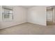 Spacious bedroom with window and hallway view at 8833 Corcovado Dr, Kissimmee, FL 34747