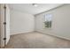 Bright bedroom featuring neutral walls and carpet at 8833 Corcovado Dr, Kissimmee, FL 34747